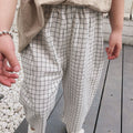 Black striped white checkered cropped pants